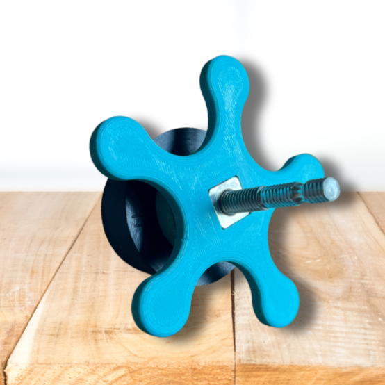 SPA FILTER SPINNER ON A WOOD PLANK TABLE WITH A WHITE BACKGROUND